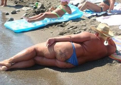 Man on the beach wearing a thong